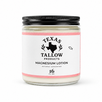 A glass jar lotion with a black metal lid and a white label reading 'Texas Tallow Products Magnesium Lotion' on a clean white background.